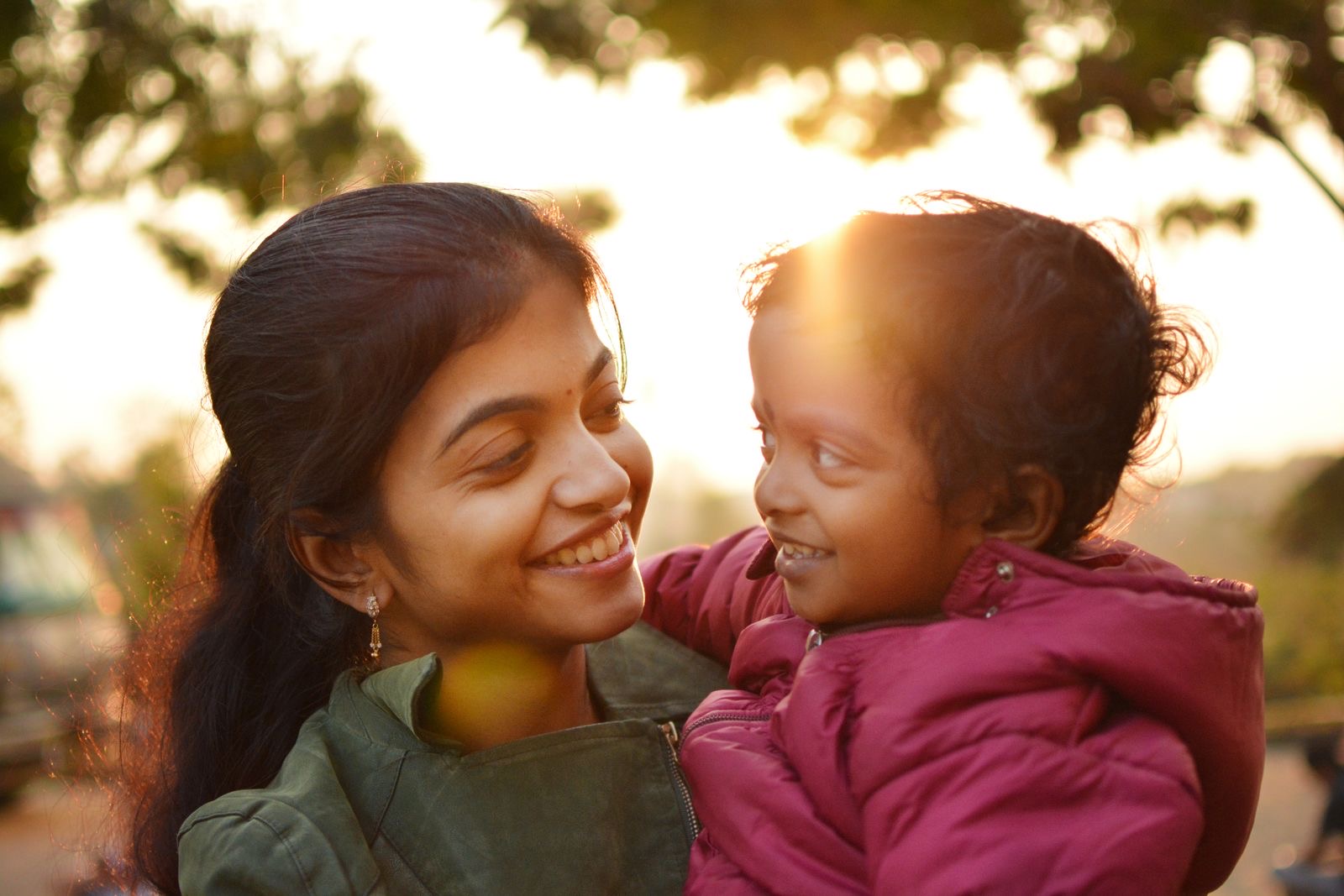 A mother and her daughter sharing a joyful moment