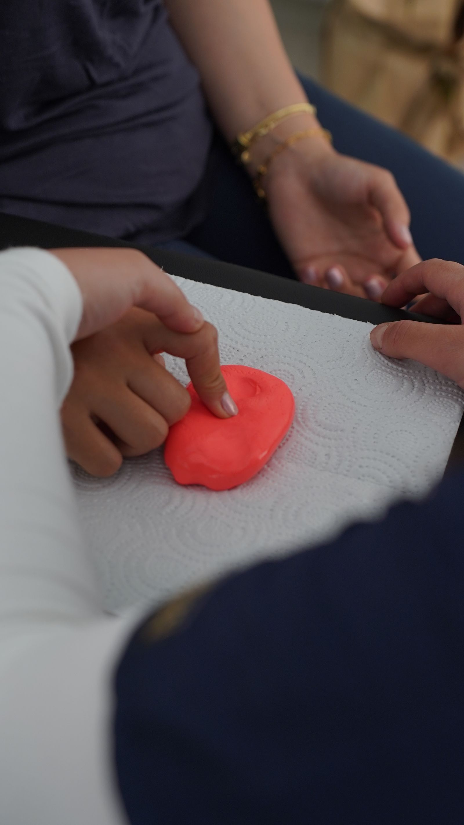 Child engaging in tactile sensory play as part of therapy